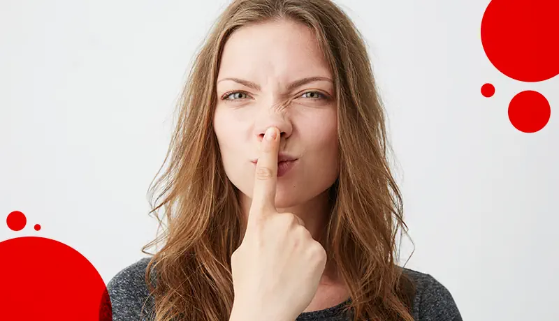 a woman touching her nose